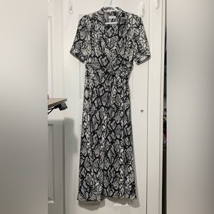 Calvin Klein patterned wrap dress with short sleeves, pockets, and waist tie